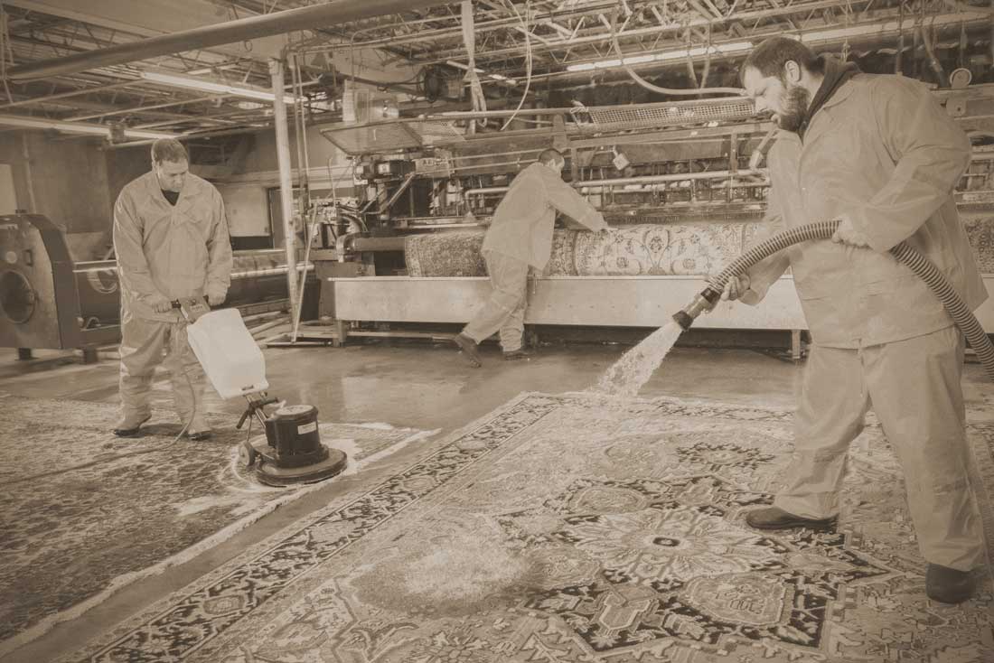 An old photo showing our antique oriental rug cleaning process.
