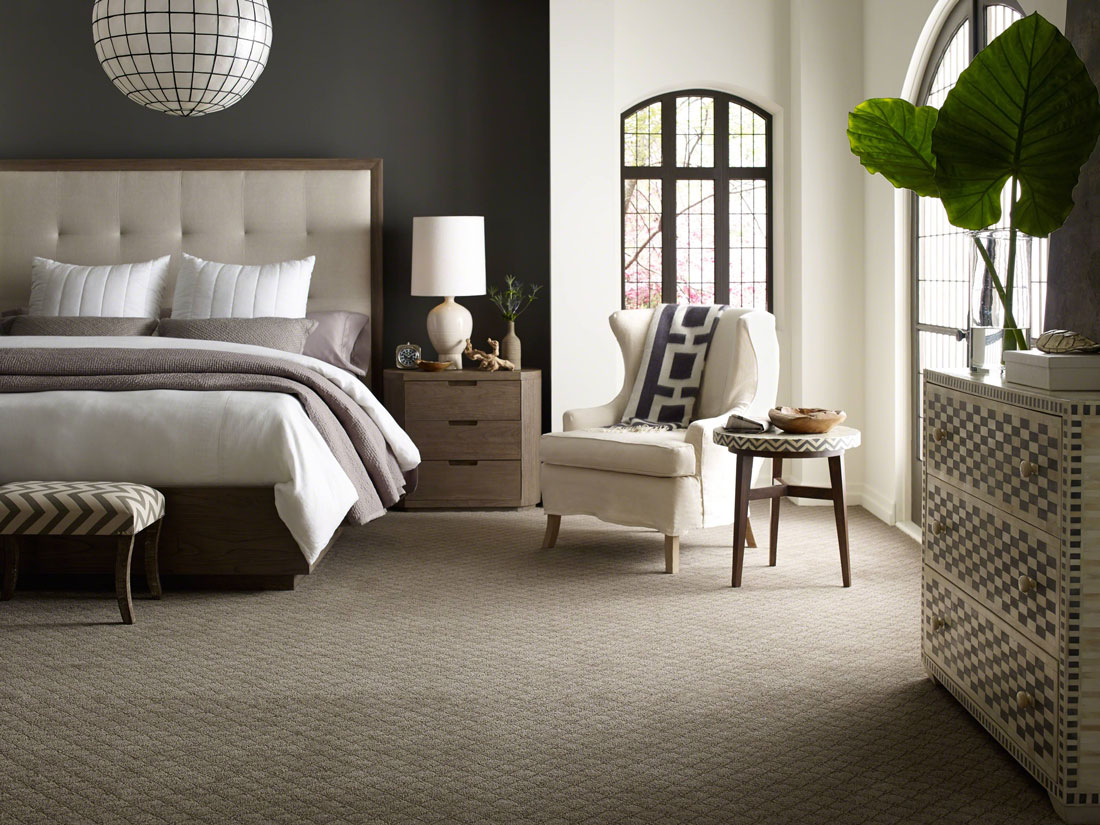 An elegant room displaying quality carpet and a quality carpet installation.
